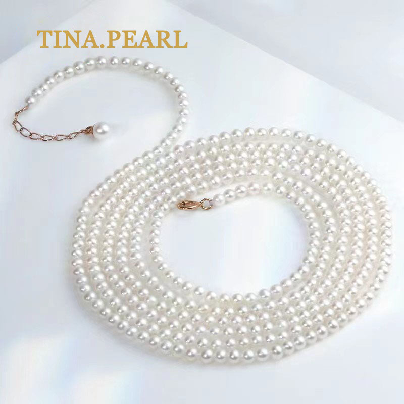 TINA Jewelry Freshwater pearl millet pearl necklace close to round shape extremely shiny pearl size 2.5-3mm can be worn in a variety of ways, the total length of the necklace is 157+3cm . The extension chain is 18 karat gold