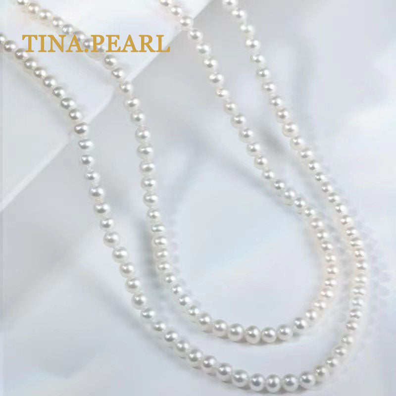 TINA Jewelry Freshwater pearl millet pearl necklace close to round shape extremely shiny pearl size 2.5-3mm can be worn in a variety of ways, the total length of the necklace is 157+3cm . The extension chain is 18 karat gold